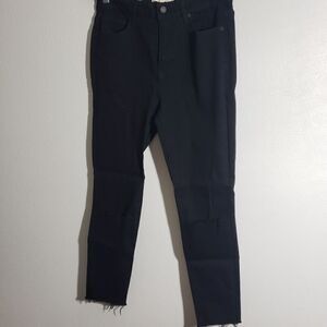 Black jeans with knee slit